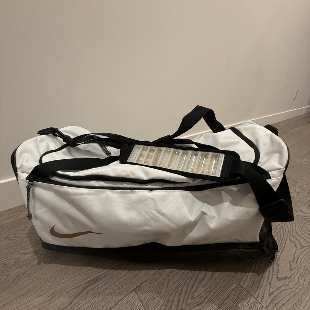 Nike Duffel Bag in White and Black with Gold Logo